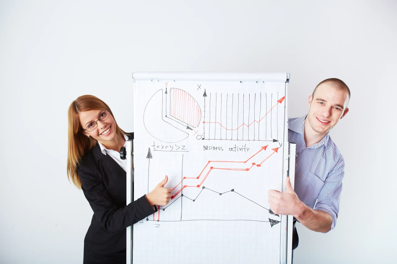 Marketing employees pointing increased sales and marketing conversions.